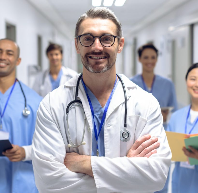 diverse-medical-team-of-doctors-looking-at-camera-while-holding-clipboard-and-medical-files.jpg